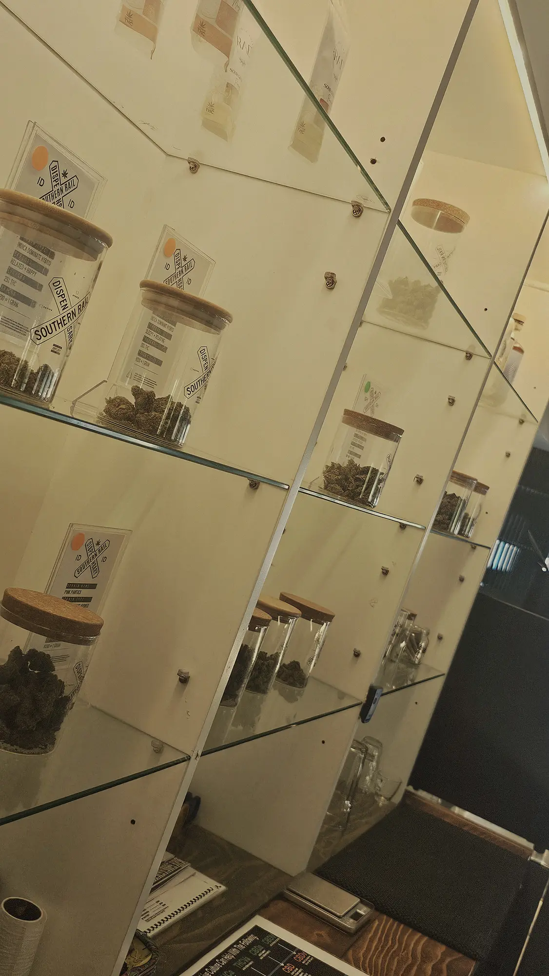 Labelled jars on the shelf at the garden counter